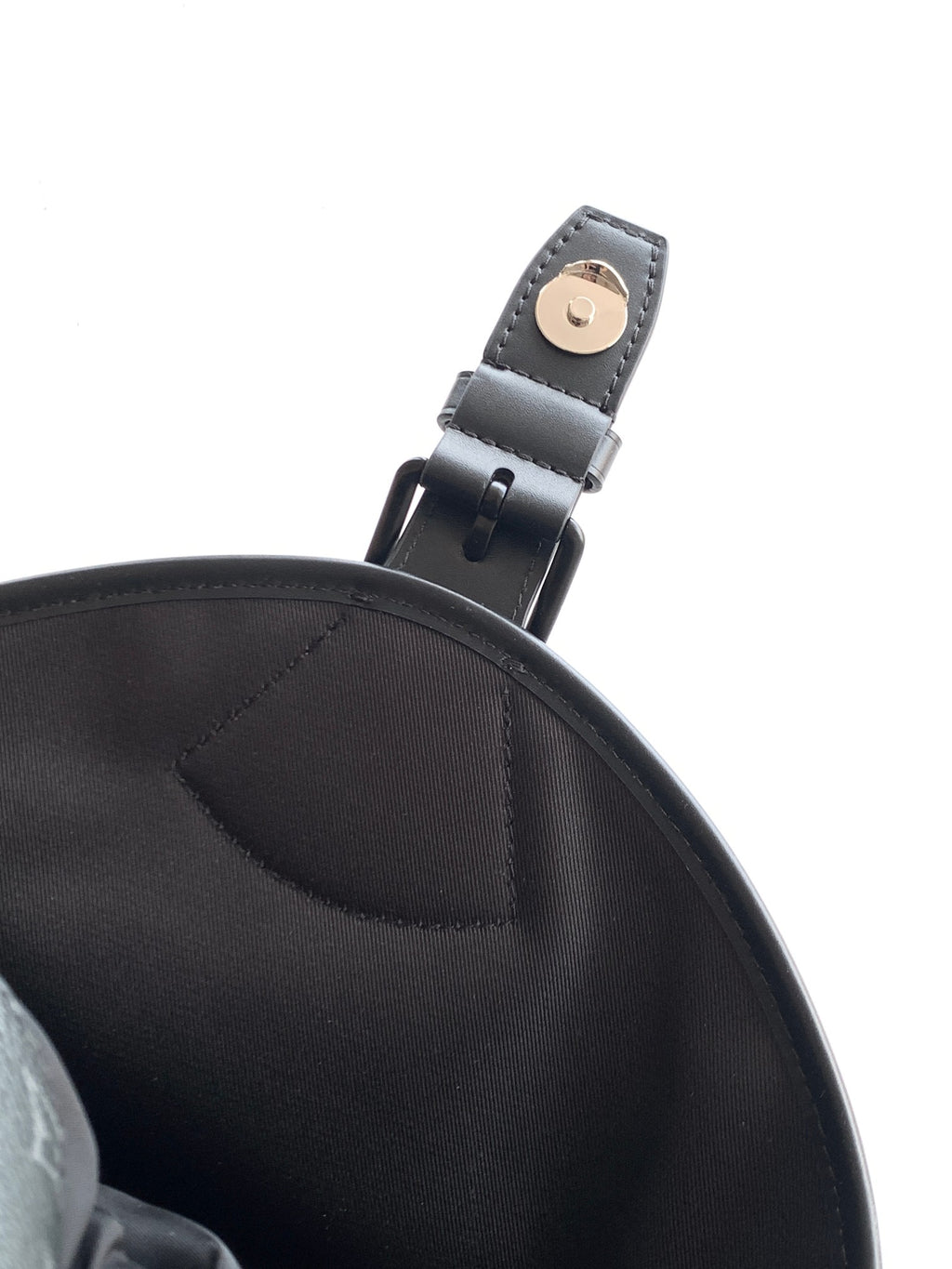 Black Louis Vuitton backpack strap connector with metal buckle on leather loop