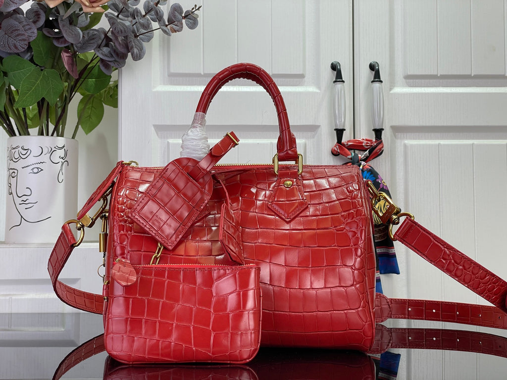 Louis Vuitton bag in red croc-embossed leather with top handles and crossbody strap