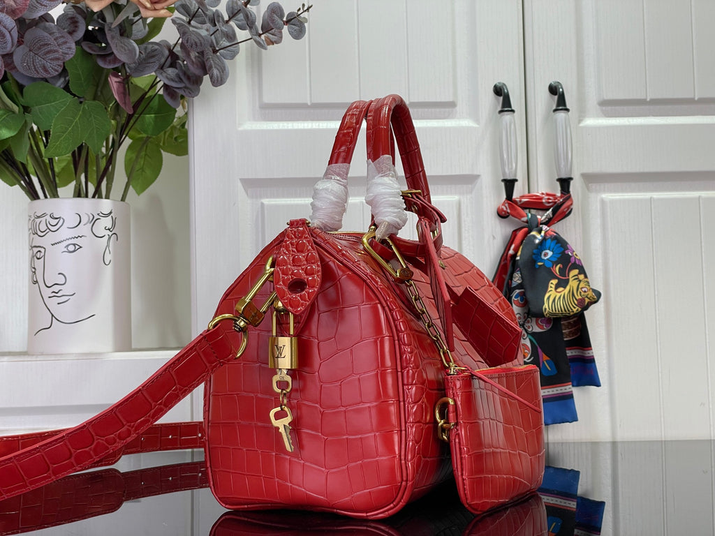 Louis Vuitton red croc-embossed shoulder bag with top handles and long crossbody strap