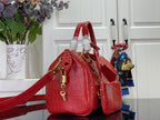 Louis Vuitton red croc-embossed shoulder bag with top handles and long crossbody strap