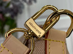 Louis Vuitton bag clasp hardware in shiny gold on tan monogram fabric