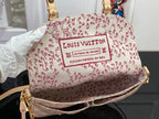 Louis Vuitton patterned shoulder bag in white with red logo print and top handle