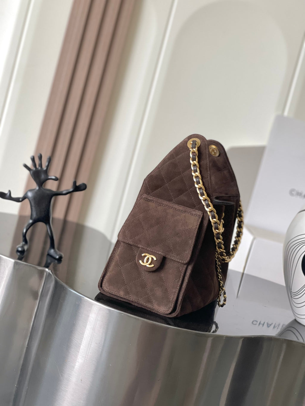 Chanel bag in dark brown suede with front logo plaque and gold chain strap