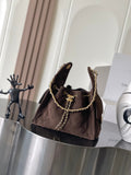 Chanel bag in dark brown fabric with gold chain shoulder strap and logo turn-lock