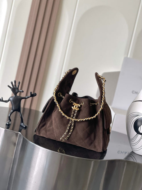 Chanel bag in dark brown fabric with gold chain shoulder strap and logo turn-lock