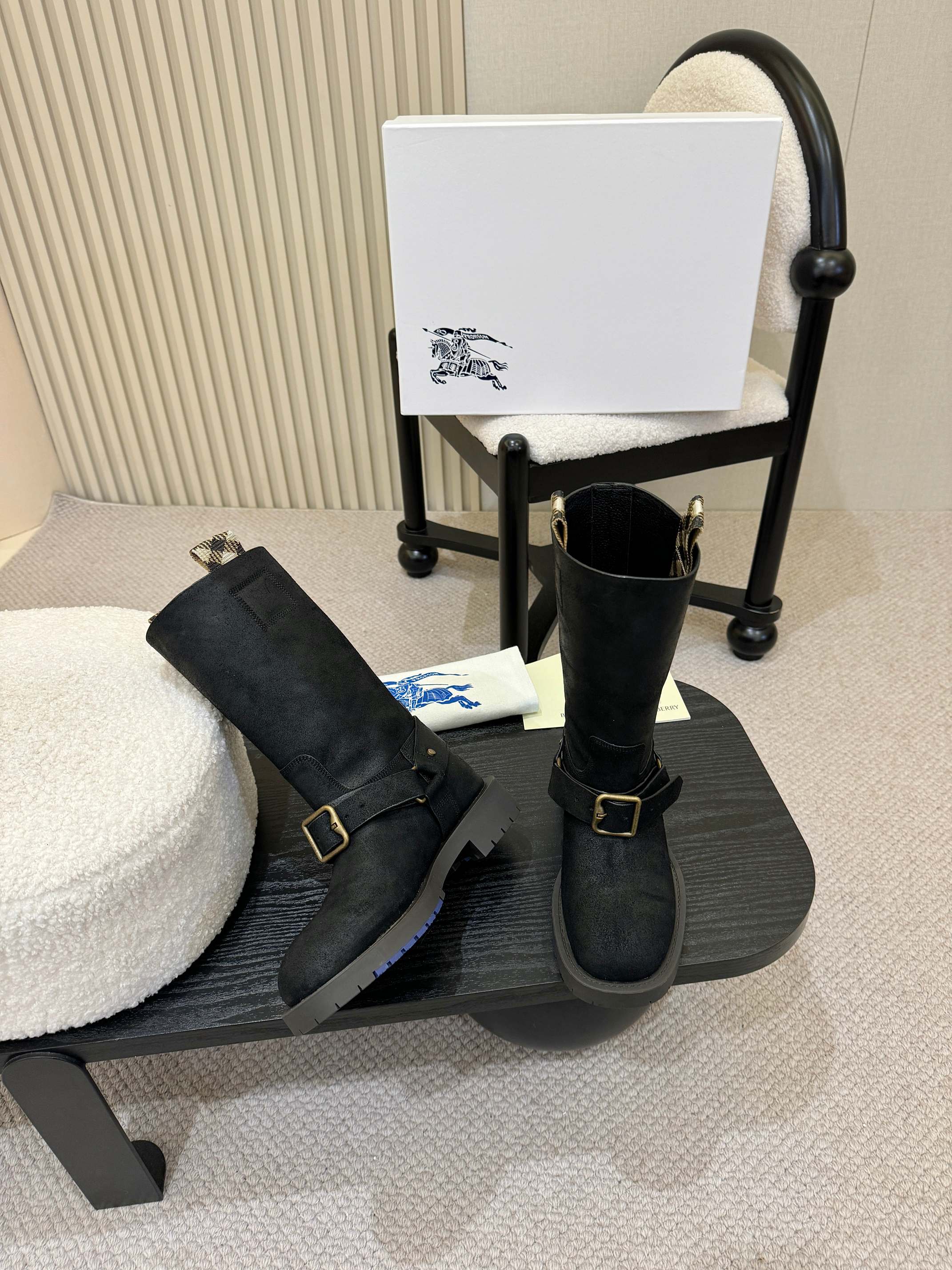 Black mid-calf boots with gold buckle straps and low block heel