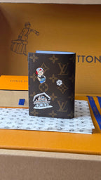Louis Vuitton monogram small bag, dark brown, with patches and appliqués