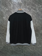 Givenchy black varsity jacket back view with white sleeves and striped collar hem
