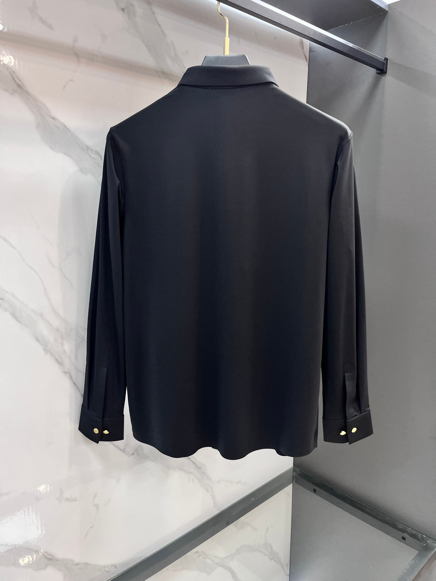 Navy long-sleeve button-up shirt, back view, with gold-tone cuff buttons