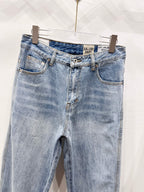 Light wash denim pants, back/side view with two back pockets and belt loops