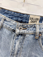 Denim pants close-up: front button fly, stitched waistband, belt loop detail