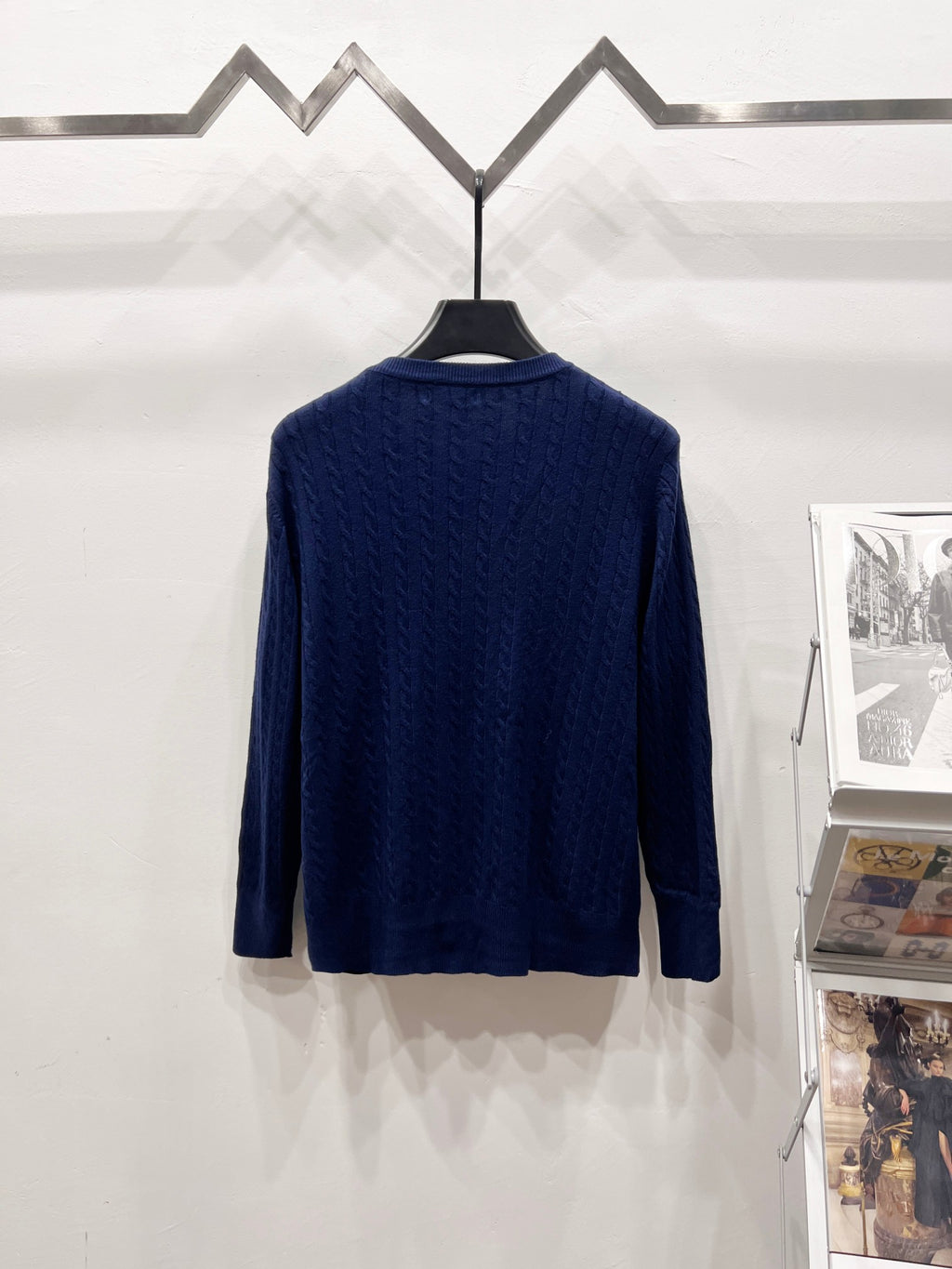 Navy blue knit cardigan back view with textured pattern and button placket