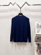 Navy blue knit cardigan back view with textured pattern and button placket