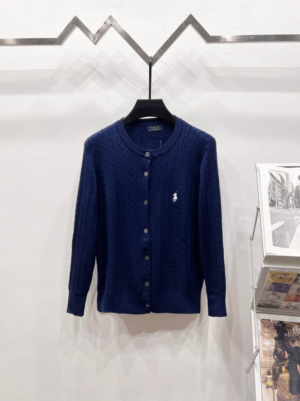 Navy blue knit cardigan with button front and small polo horse logo