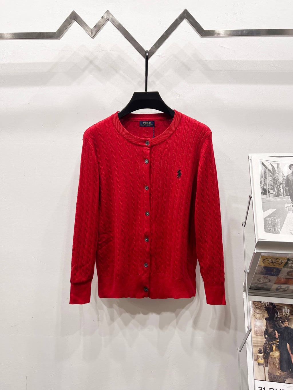 Red button-front cable-knit cardigan sweater with ribbed collar and cuffs