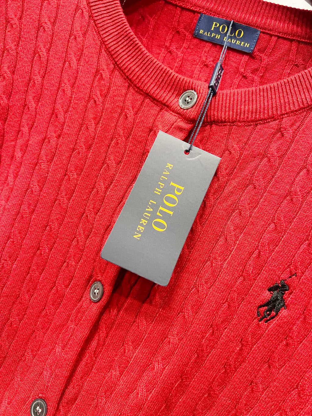 Red cable-knit cardigan close-up with Polo Ralph Lauren neck label and buttons