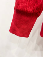 Red ribbed knit cardigan hem and sleeve cuff detail