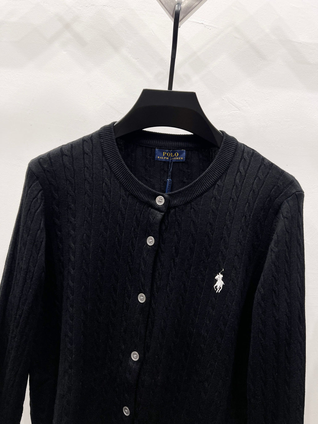 Ralph Lauren knit cardigan close-up with button front and embroidered polo rider