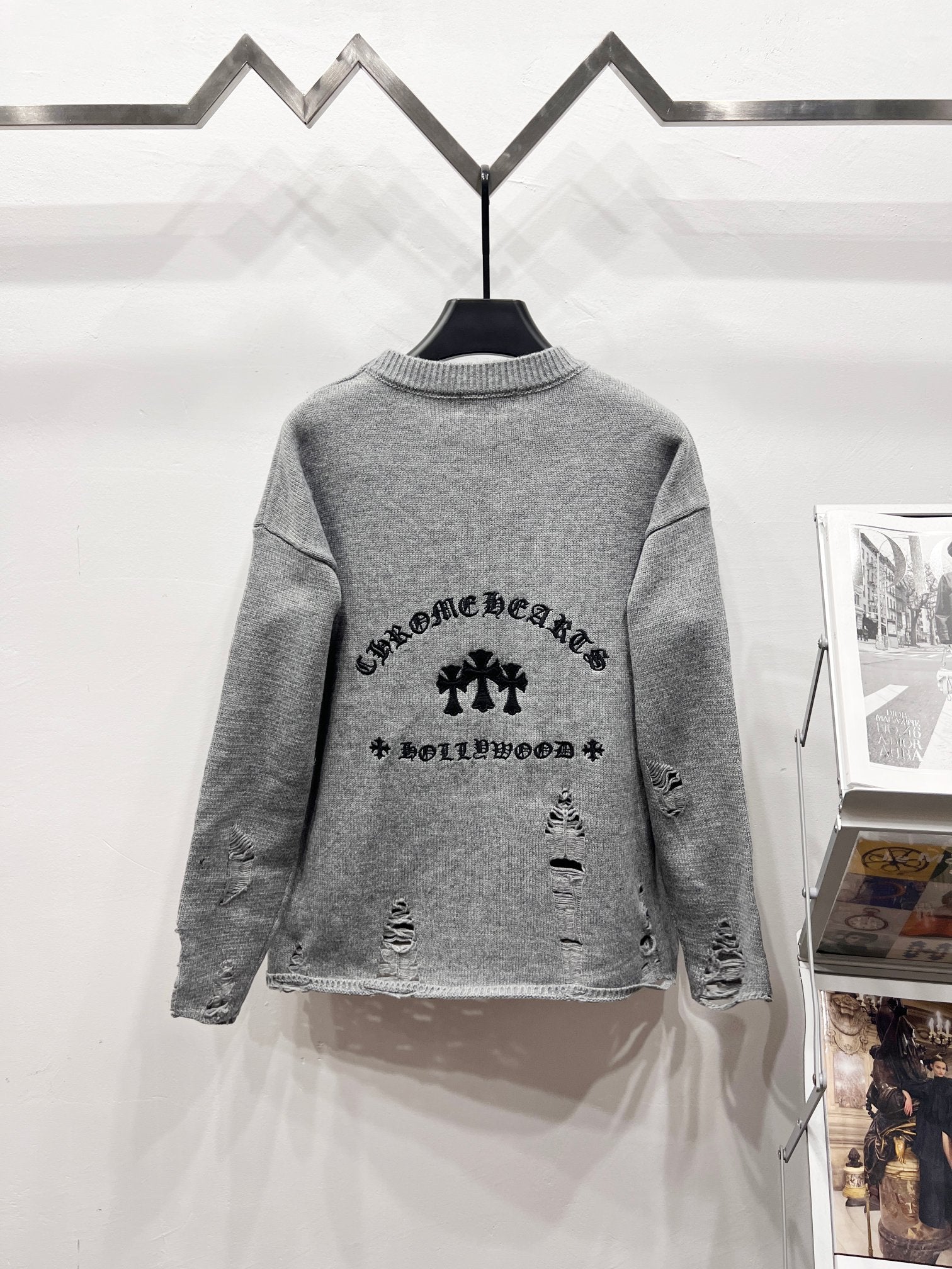 Gray crewneck sweater with large back graphic print and distressed detailing