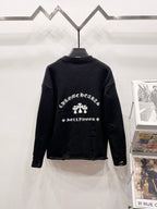 Black knit sweater with ornate white graphic print on the back yoke area