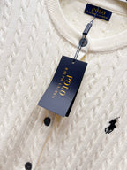 Cream knit cardigan neckline with inner tag and button-front detail