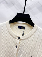 Cream knit cardigan crew neckline with buttons and Polo label at collar