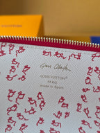 Louis Vuitton small bag lining close-up: red pattern, 'Made in Spain' text