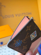 Small Louis Vuitton monogram pouch with pink top panel and multicolor patch charm