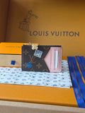 Small Louis Vuitton monogram wristlet pouch with multicolor patches and pink card slot