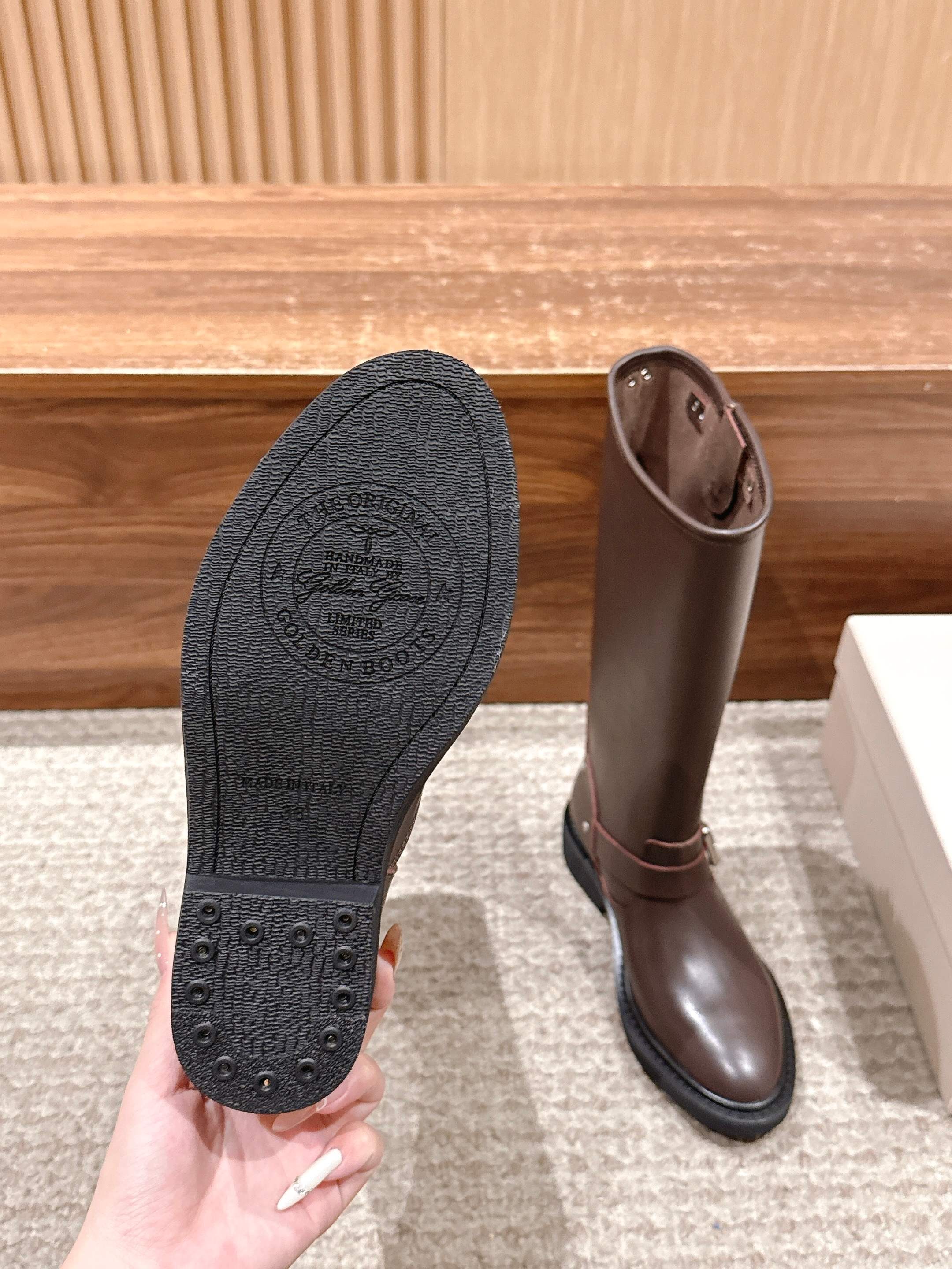 Golden Goose boot sole underside with tread pattern and dark rubber outsole