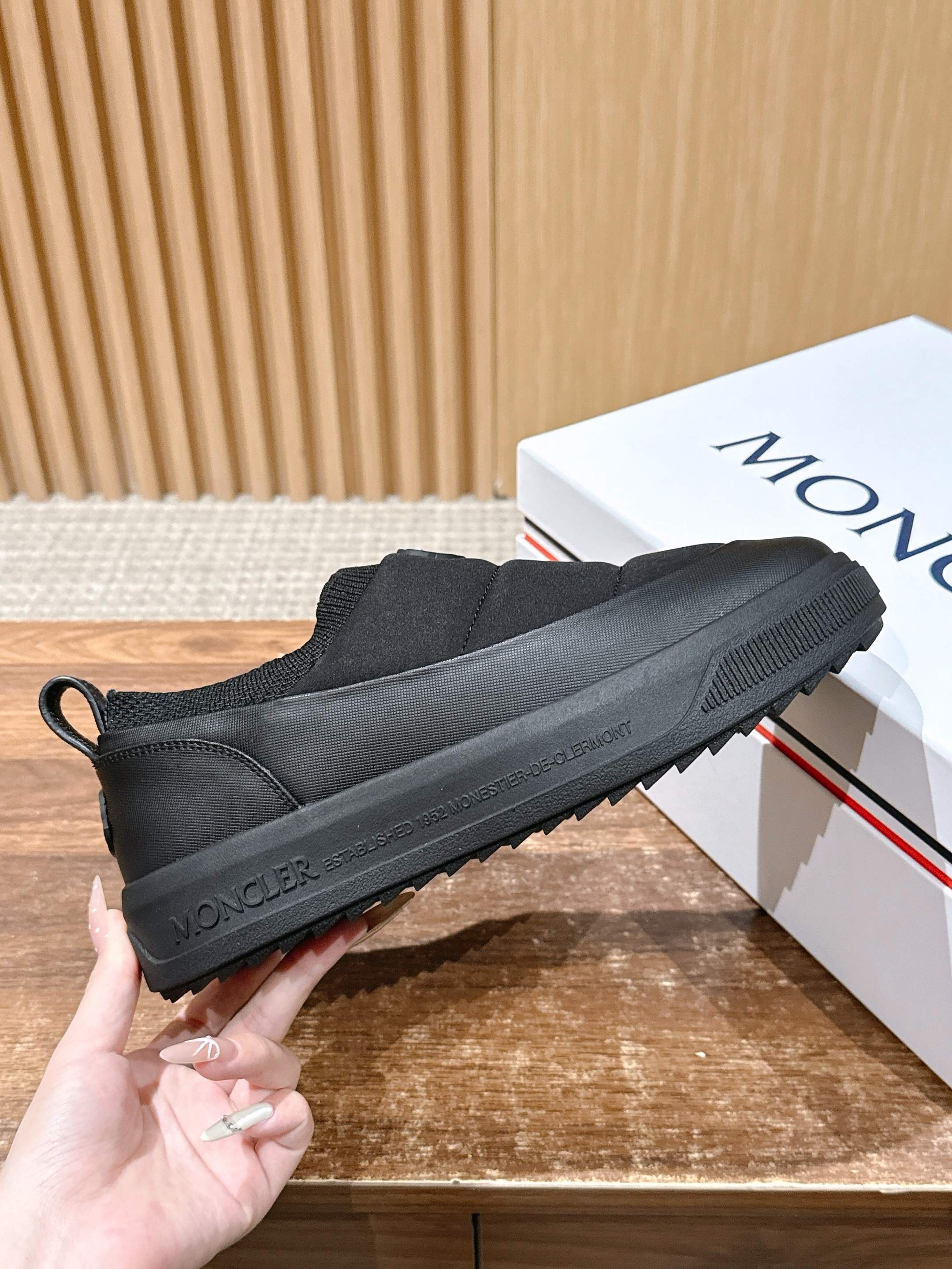 Moncler slip-on shoe in dark gray with textured sole and brand lettering