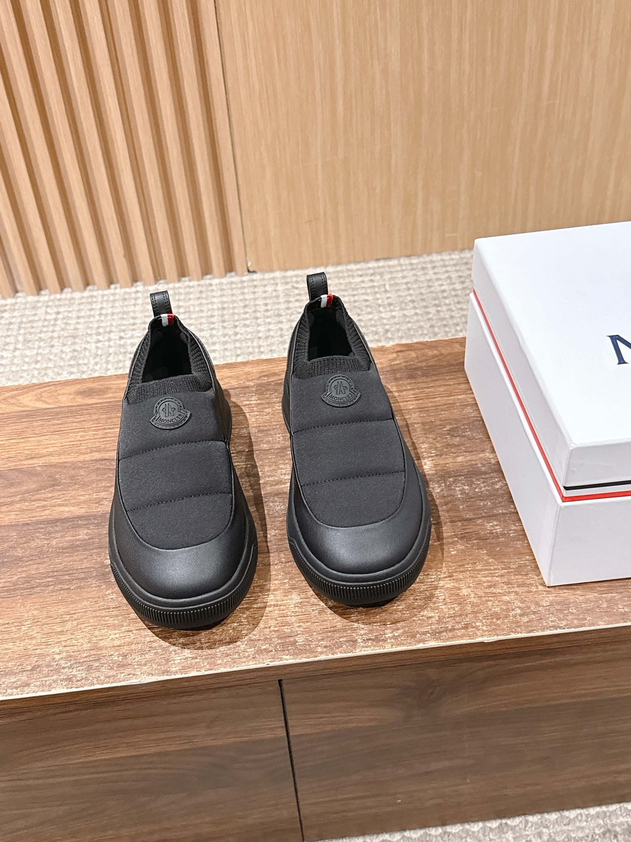 Moncler slip-on shoes in dark gray with elastic side panels and logo patch
