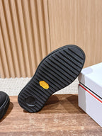 Moncler slip-on shoes outsole with grippy tread and small yellow emblem