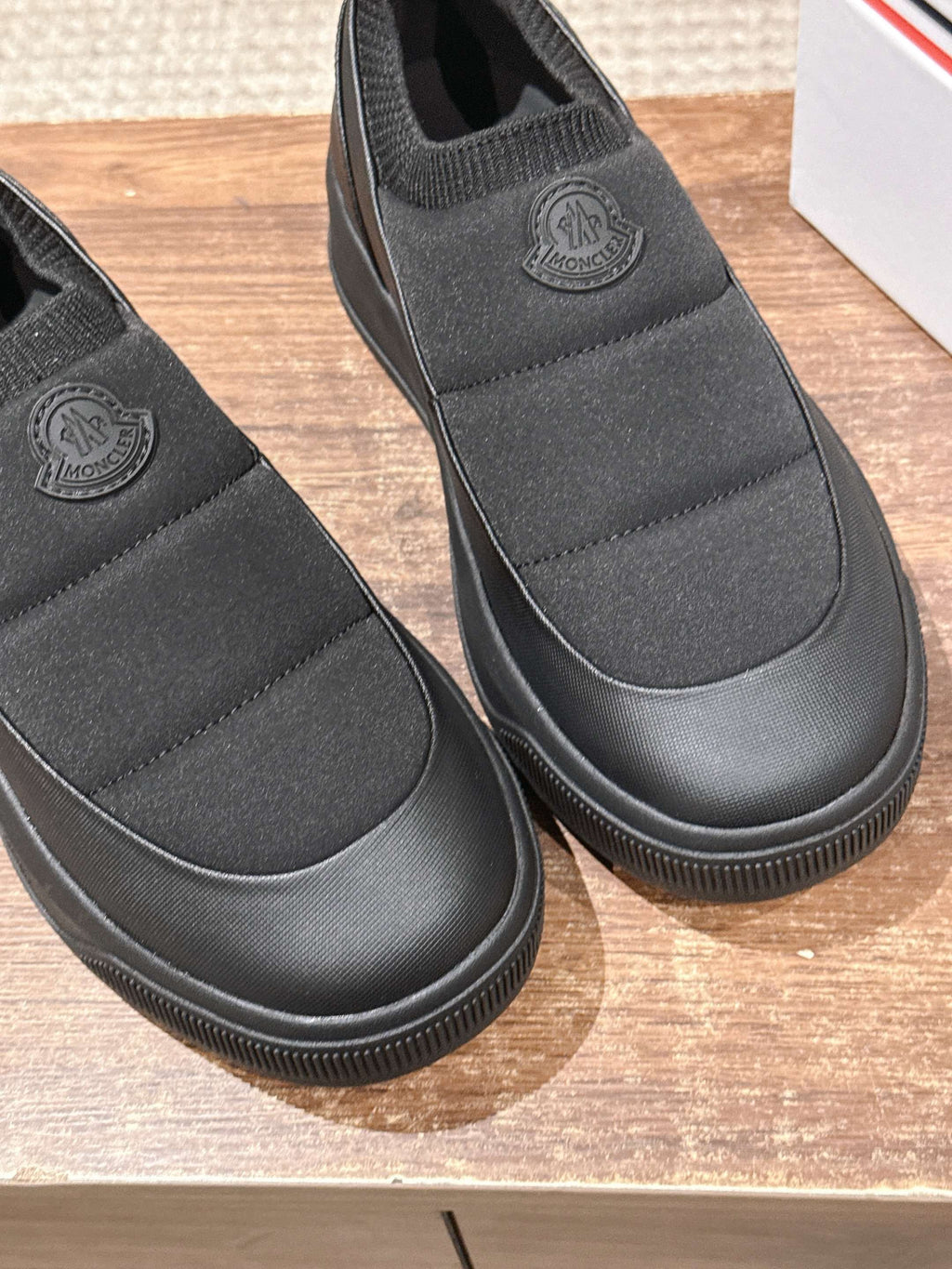 Moncler slip-on shoes in dark gray with ribbed toe and embossed heel logo