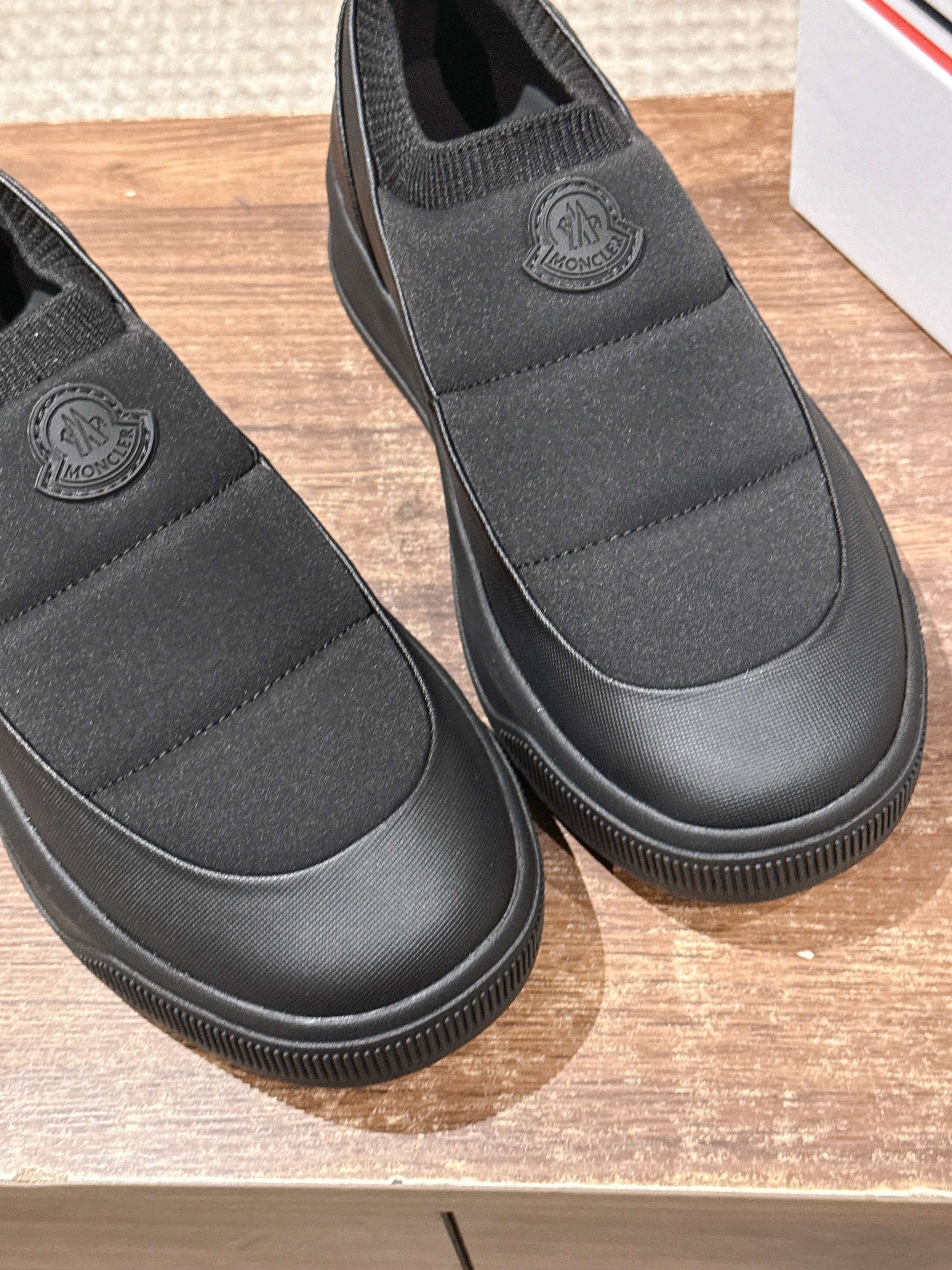 Moncler slip-on shoes in dark gray with ribbed toe and embossed heel logo