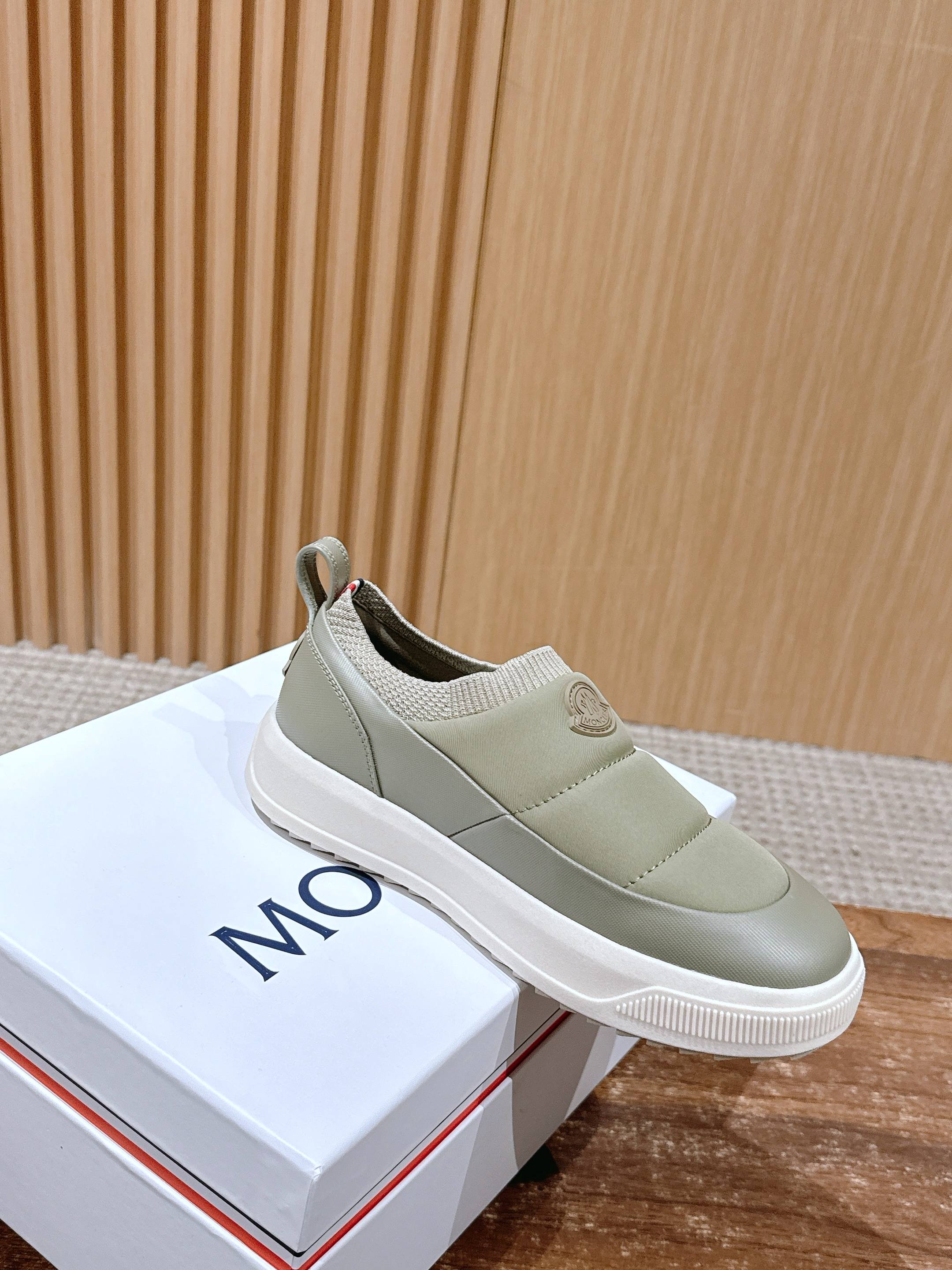 Light beige Moncler slip-on sneaker with elastic side panels and white rubber sole