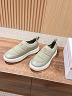 Pair of Moncler light beige slip-on sneakers with elastic gore and round logo patch