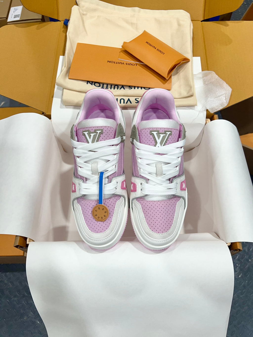 Louis Vuitton trainer sneakers pair with white laces and lilac side panels