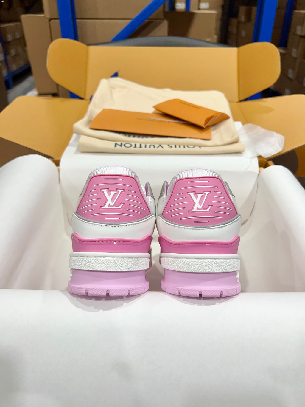 Louis Vuitton trainer sneakers with pink heel caps featuring LV monogram