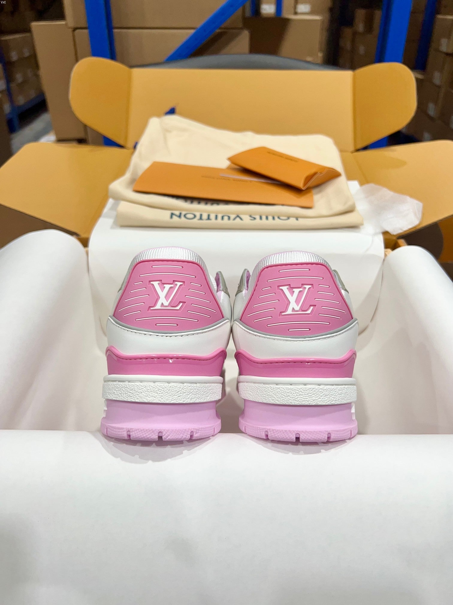 Louis Vuitton trainer sneakers with pink heel caps featuring LV monogram