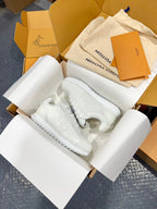 Louis Vuitton white low-top sneakers with lace-up closure and thick rubber sole