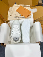 Louis Vuitton sneakers with white laces and visible outsole tread