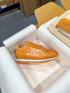 Louis Vuitton unisex sneakers orange leather with white LV logo and white edge sole