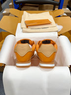 Louis Vuitton unisex sneakers back view, orange uppers with beige heel panels and white soles