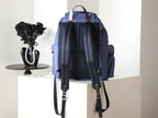 Prada blue nylon backpack rear view with back mesh panel and straps