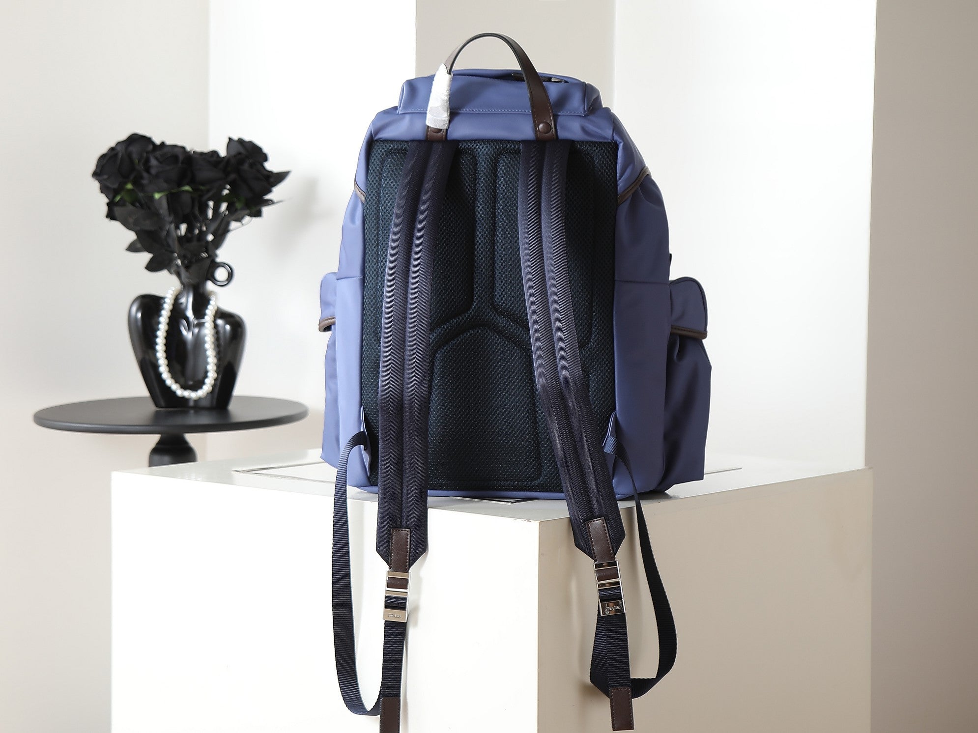Prada blue nylon backpack rear view with back mesh panel and straps