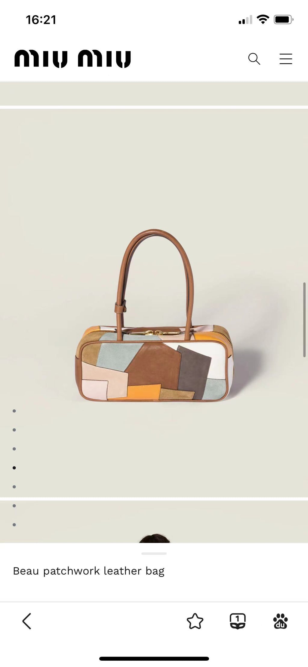 Patchwork leather bag side view with top handles, showing orange trim and multicolor patch panels.