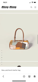 Patchwork leather bag side view with top handles, showing orange trim and multicolor patch panels.