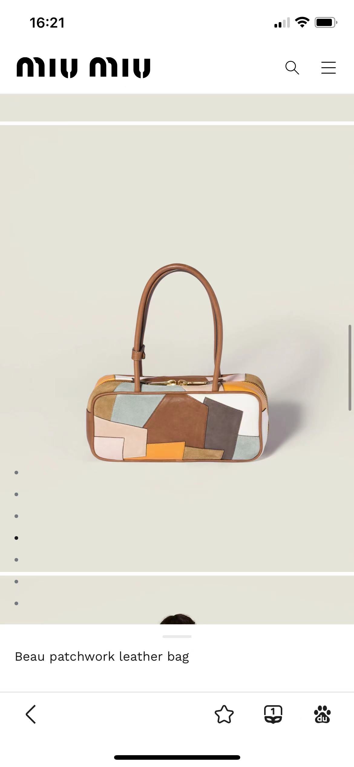 Patchwork leather bag side view with top handles, showing orange trim and multicolor patch panels.