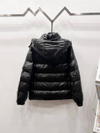 Black long puffer jacket back view with high collar and quilted horizontal stitching